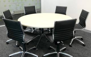 Round Meeting Table with Black Aria Medium Back Chairs